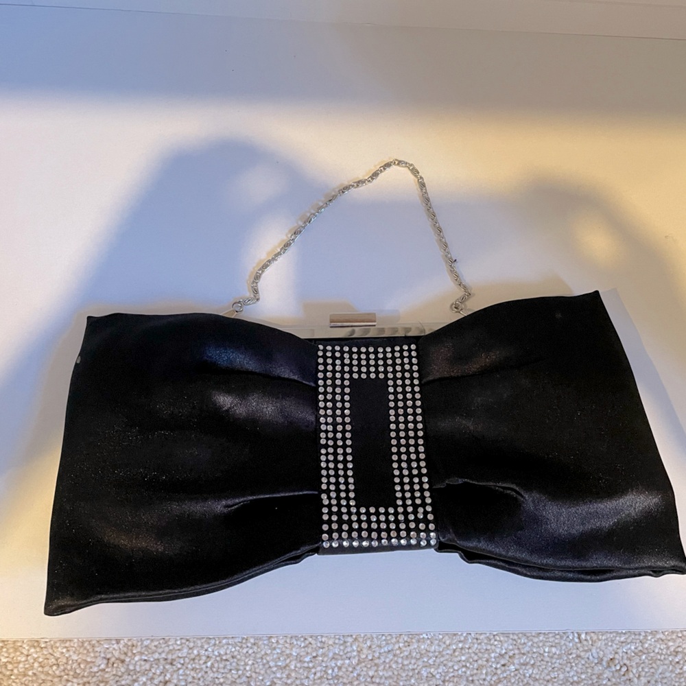 Bowtie shaped black purse made with silk fabric and jewels